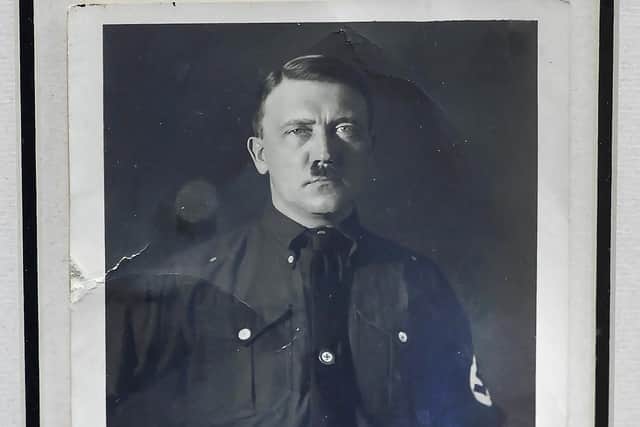 A personally signed portrait of former Nazi dictator Adolf Hitler which is set to go under the hammer along with other historical items in Belfast on Tuesday June 6