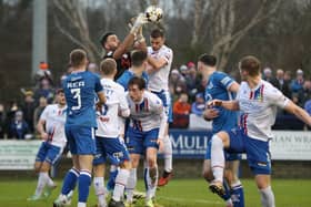 Loughgall's Berraat Turker comes to claim the ball ahead of Linfield's Matthew Fitzpatrick. PIC: INPHO/Brian Little