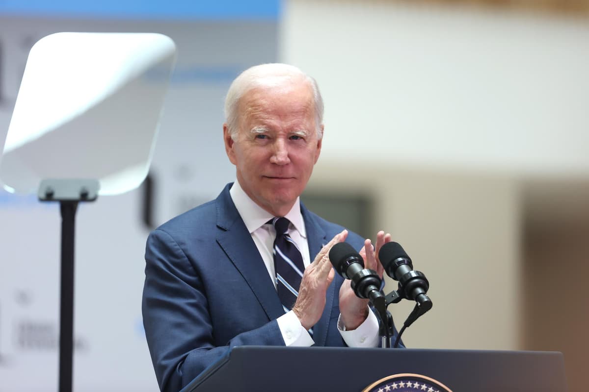 ​Behind the scenes at Biden's visit is of a giant iceberg with a pair of swan's legs attached, furiously kicking