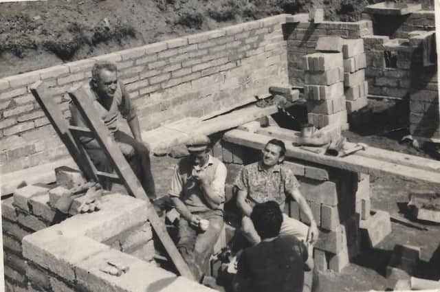 Established in 1963, Setanta Construction in Magherafelt has evolved over the six decades. Pictured is Liam Gribbin with co-workers taking a tea break on the building site during the early Gribbin Construction days