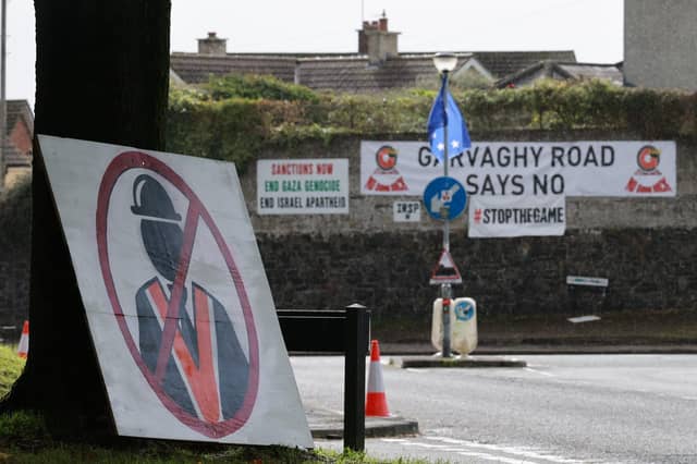 The High Court has refused a legal challenge to the Secretary of State's ban on the Orange parade on the Garvagh Road. Pictured are posters on the Garvaghy Road in Portadown, Co Armagh earlier this month.