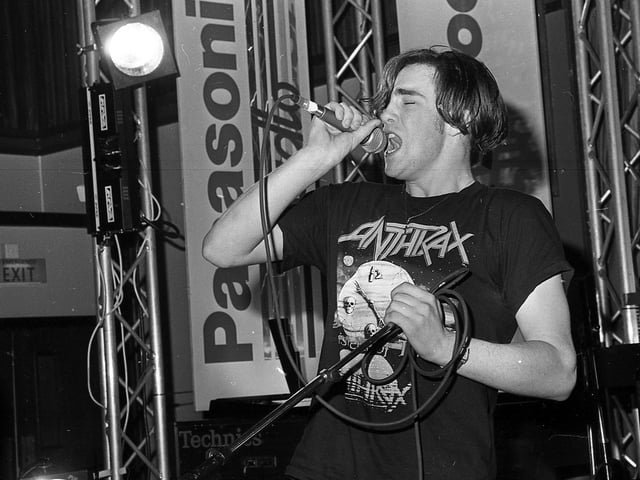 At the end of February 1992 the heat of the beat brought pupils from schools across Northern Ireland to Belfast for the Panasonic Rock School. For the seven finalist bands, it was gig which could lead them to the big time. First there would be a spot on Radio Five, then the chance of making it to the final in London and meeting the greats including Toyah Wilcox, Robert Plant and Phil Oakey. Pictured taking part in the finals is John Harrison. Picture: News Letter archives