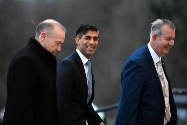 Prime Minister Rishi Sunak (centre) with Northern Ireland Secretary Chris Heaton-Harris and new appointed speaker of the Northern Ireland Assembly Edwin Poots arriving at Parliament Buildings at Stormont Castle, Belfast, today