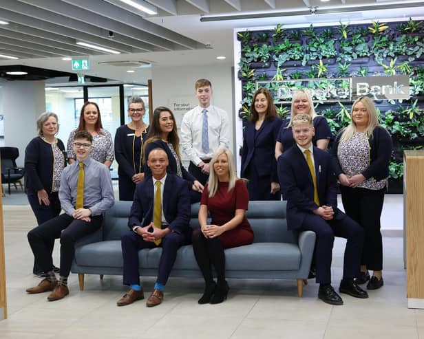 Danske Bank staff celebrate the reopening of the Abbey Centre branch following the completion of a major expansion and refurbishment project