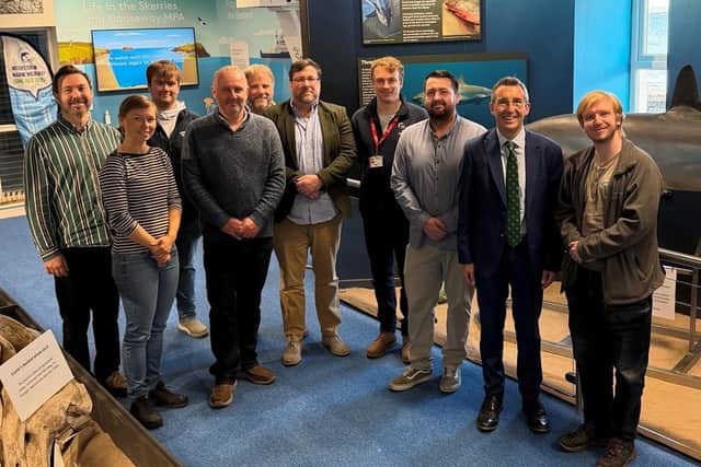 Daera minister Andrew Muir (second right) with members of the Portrush Coastal Zone team.
