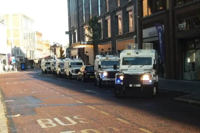 Police vehicles waiting out of sight from Belfast City Hall on a nearby street on the morning of Armistice Day, Saturday November 11 2023 amid concerns that an anti Israel protest would be held at the same time as the traditional 11am remembrance service at the cenotaph
