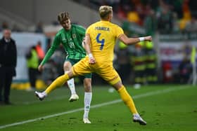 Northern Ireland's Isaac Price challenges for the ball with Romania's Cristian Manea during the friendly match last Friday