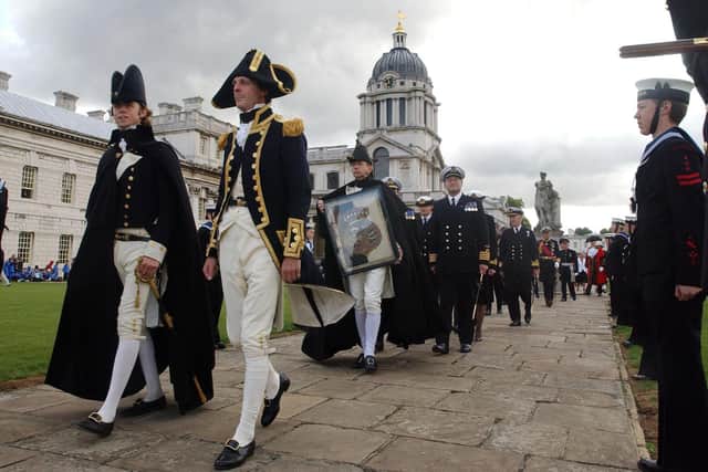 A procession dressed in period costumes leave the Painted Hall in the former Royal Naval College at Greenwich, as they re-enact the funeral of Admiral Lord Horatio Nelson in 1806 in September 2005. Picture: John Stillwell/PA