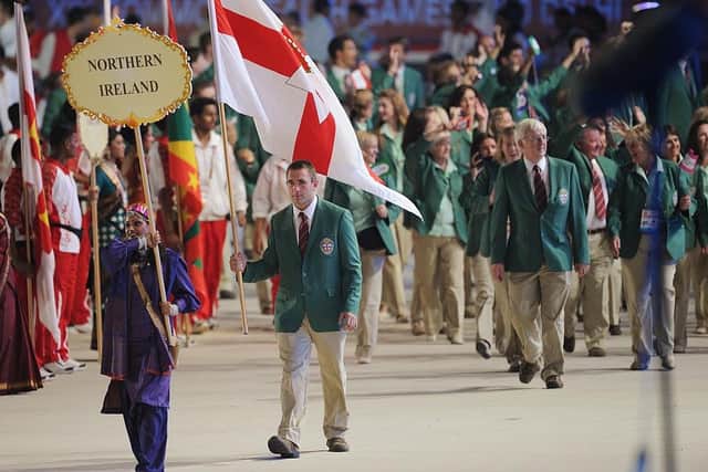 The Northern Ireland delegation led by flagbearer and wrestler Mark Montgomery arrives onto the field for the XIX Commonwealth Games opening ceremony at the Jawaharlal Nehru stadium in New Delhi on October 3, 2010 (WILLIAM WEST/AFP via Getty Images)