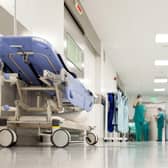 ADOBE STOCK Blurred figures of people with medical uniforms in hospital corridor