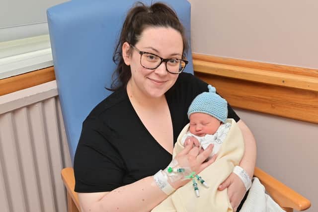 Marisa McBride with new baby Isaac who was born at midnight at the RVH in Belfast. He weighed 7lbs. Photo: Colm Lenaghan