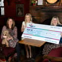 Charlie’s Bar Enniskillen has raised £23,000 to help Age NI and the South West Age Partnership (SWAP) in their work to help combat loneliness. Pictured are Rosalind Cole, fundraising manager of Age NI, Una Burns, manager of Charlie’s Bar Enniskillen and Allison Forbes, project manager of South West Age Partnership (SWAP)