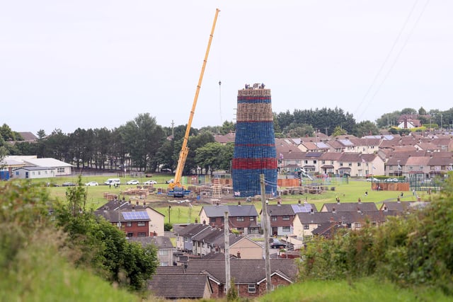 Press Eye - Belfast - Northern Ireland - 9th July 2022Bonfire builders use a crane at the Craigyhill Bonfire in Larne, Co. Antrim.