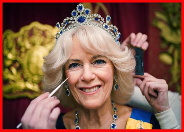 Studio artists add the finishing touches to a new Queen Consort wax figure at Madame Tussauds in London, ahead of the coronation of King Charles III on May 6.