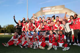 Larne players celebrate after lifting the Gibson Cup at Inver Park