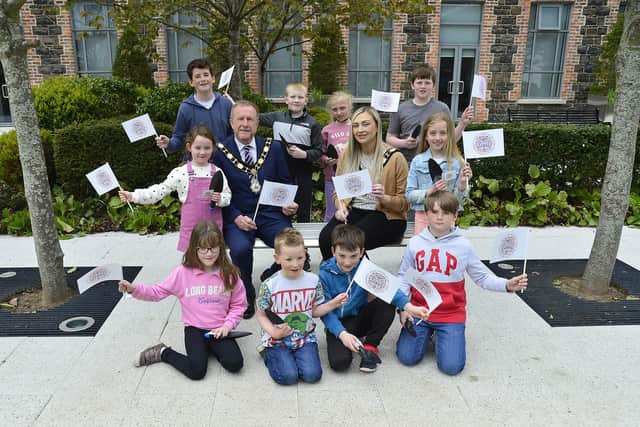 Mayor, alderman Stephen Ross and Deputy Mayor, councillor Leah Smyth, are joined by local children to launch the council’s line-up of Coronation events