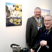The Mayor of Causeway Coast and Glens Borough Council, Councillor Ivor Wallace, pictured at the opening of the Inside Out exhibition by the Pavestone Collective with Chris Magee and art tutor Louie Winward