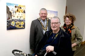 The Mayor of Causeway Coast and Glens Borough Council, Councillor Ivor Wallace, pictured at the opening of the Inside Out exhibition by the Pavestone Collective with Chris Magee and art tutor Louie Winward