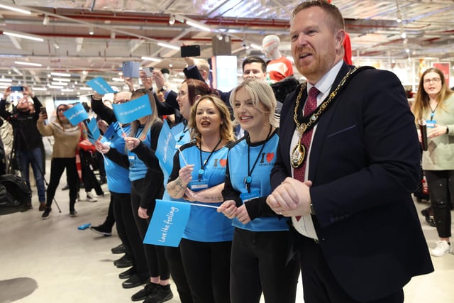 Primark colleagues welcome the first customers into the store with Cllr Paul Greenfield, Lord Mayor of Armagh City, Banbridge & Craigavon Borough Council