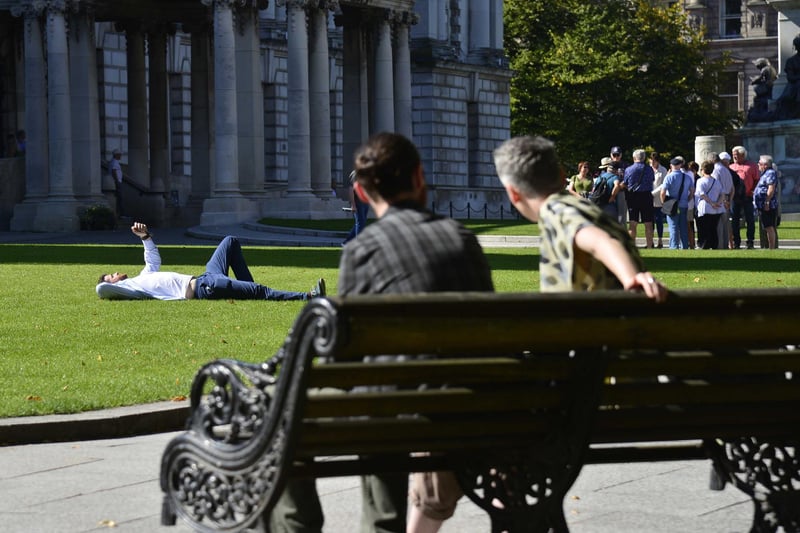 Belfast weather forecast for the coming days suggests the sun will be here for a little longer.People pictured enjoying the sunshine at Belfast City Hall in Northern Ireland.
Picture By: Arthur Allison/Pacemaker Press.