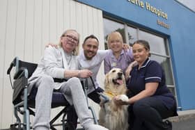 From left, Patricia Hutchinson with nurse Andrew Hunter, healthcare assistant Rachel McGlone and clinical nurse specialist Laura Cudden with volunteer therapy dog Sandi at the Marie Curie Belfast hospice