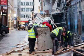 Workers clear up debris after scaffolding collapsed in Castle Lane in Belfast city centre.  Pic: Jonathan Porter/PressEye