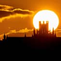 Census figures for England and Wales reveal that Christians have the oldest average age among all main religious groups. The photo shows the sun setting Behind Ely Cathedral in Cambridgeshire, England.