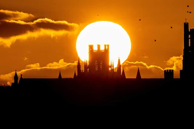 Census figures for England and Wales reveal that Christians have the oldest average age among all main religious groups. The photo shows the sun setting Behind Ely Cathedral in Cambridgeshire, England.