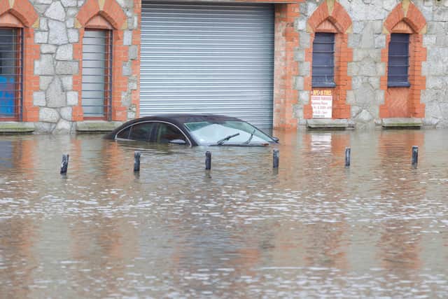 A stricken car in Newry on October 31, 2023, when the city's canal burst its banks and Co Down saw heavy flooding in general