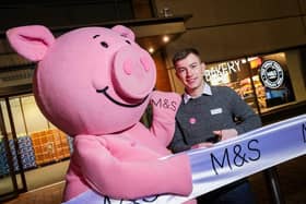 Pictured is store manager Nathan Moore and Percy Pig