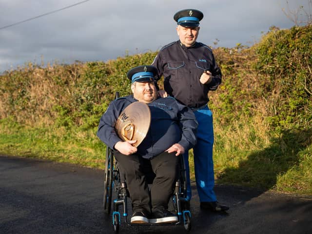 Ivan Webb with his son Timmy, who are members of Markethill Protestant Boys Flute Band.