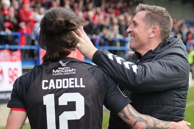 Crusaders manager Stephen Baxter embraces goalscorer Declan Caddell at full-time
