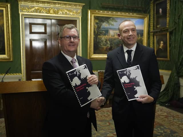 Northern Ireland Secretary Chris Heaton-Harris and DUP leader Sir Jeffery Donaldson at Hillsborough Castle hold the agreement, called ‘Safeguarding the Union’ on January 31. This document, including its title, was a sales-pitch, full of adjectives, superlatives and implied promises rather than detail. Photo: Niall Carson/PA Wire