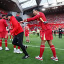 Liverpool captain Virgil van Dijk (right) sharing a laugh with Jurgen Klopp following the manager's final game in charge of the club on Sunday at Anfield. (Photo by Clive Brunskill/Getty Images)