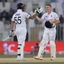 Harry Brook of England celebrates with Ben Stokes after reaching his century during the First Test Match between Pakistan and England at Rawalpindi Cricket Stadium. (Photo by Matthew Lewis/Getty Images)