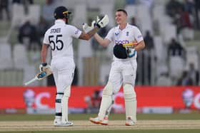 Harry Brook of England celebrates with Ben Stokes after reaching his century during the First Test Match between Pakistan and England at Rawalpindi Cricket Stadium. (Photo by Matthew Lewis/Getty Images)