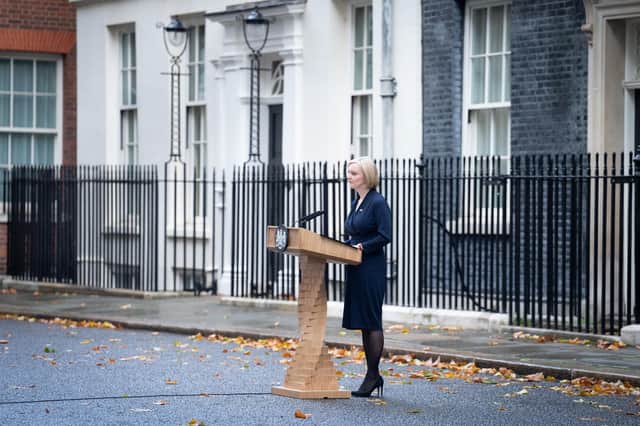 Prime Minister, Liz Truss with her husband Hugh O'Leary, makes a statement outside 10 Downing Street, London, where she announced her resignation as Prime Minister.