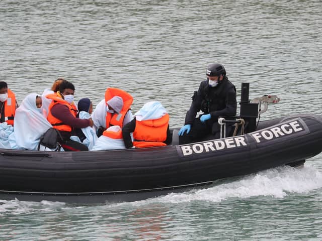 A group of people thought to be migrants are brought into Dover, Kent, by Border Force officers in 2020. Interim leader of the DUP, Gavin Robinson, has today warned against Northern Ireland becoming "a magnet for asylum seekers seeking to escape enforcement" of UK immigration laws