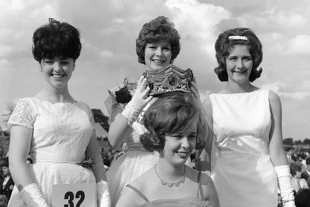 Monica Smith, representing Bolsover Colliery, is crowned Coal Queen at the 1963 Miners Rally and Gala by the previous incumbent Brenda Blood as runners-up Margaret Smith and Pamela Woodcok look on.