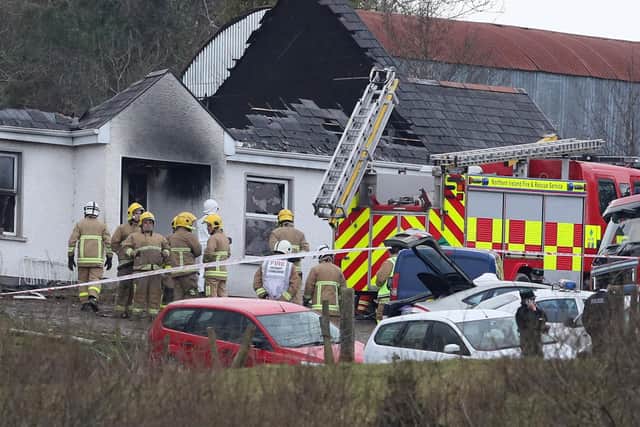 Forensic and fire officers at the house in Derrylin, Fermanagh, in 2018