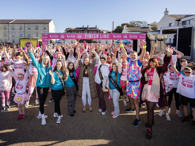 Runners, walkers, and pooches were splashed in pink powder from head to toe for a great cause as Cancer Focus NI’s first Pink Run took place in Londonderry. Picture Steven McAuley/McAuley Multimedia