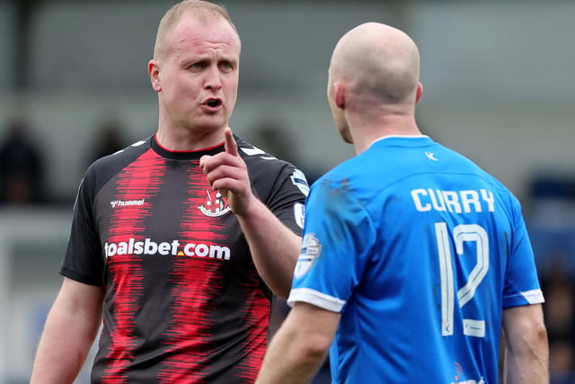 Crusaders Jordan Owens and Dungannon's Dean Curry continue discussions