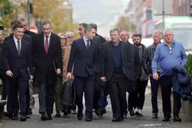 Garvaghy Road residents, including their spokesperson Breandán Mac Cionnaith and their legal team, arriving at court on Monday. Picture by Jonathan Porter/PressEye