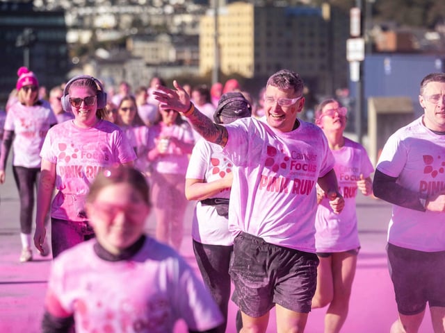 Runners, walkers, and pooches were splashed in pink powder from head to toe for a great cause as Cancer Focus NI’s first Pink Run took place in Londonderry. Picture Steven McAuley/McAuley Multimedia