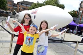 Grace Alexander, Archie Alexander and Olivia Alexander from Omagh at the 72ft space rocket replica at Writers' Square in Belfast. Pic: Arthur Allison/Pacemaker Press