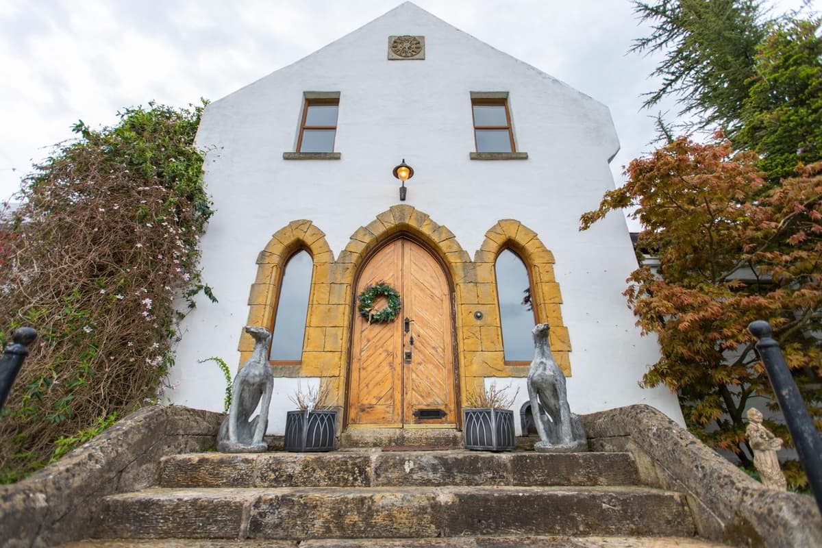 This church-like five-bedroom family home even has its own wine cellar and music room