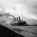 The RMS Titanic leaving Belfast to start her trials, being pulled by tugs, shortly before her disastrous maiden voyage of April 1912. (Photo by Topical Press Agency/Getty Images)