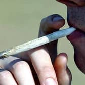 File photo dated 27/01/04 of a man smoking a cannabis joint.