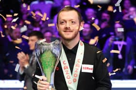 Northern Ireland’s Mark Allen celebrates with the trophy following victory in the Cazoo UK Snooker Championship at the York Barbican.
