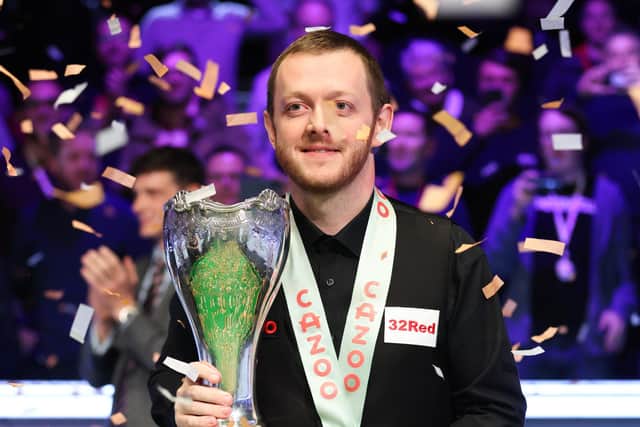 Northern Ireland’s Mark Allen celebrates with the trophy following victory in the Cazoo UK Snooker Championship at the York Barbican.